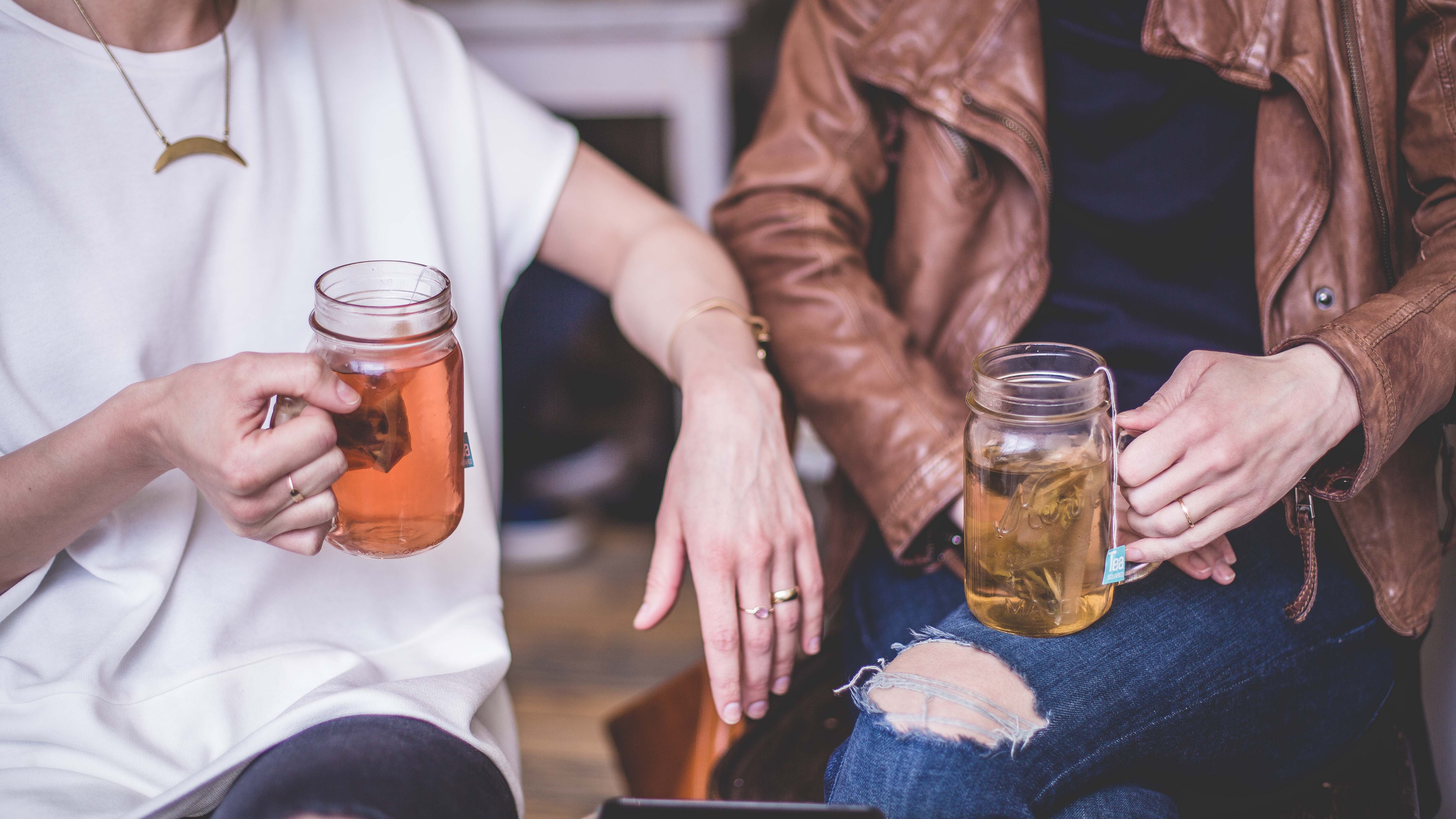 trendy-ladies-drinking-tea-from-mason-jars
