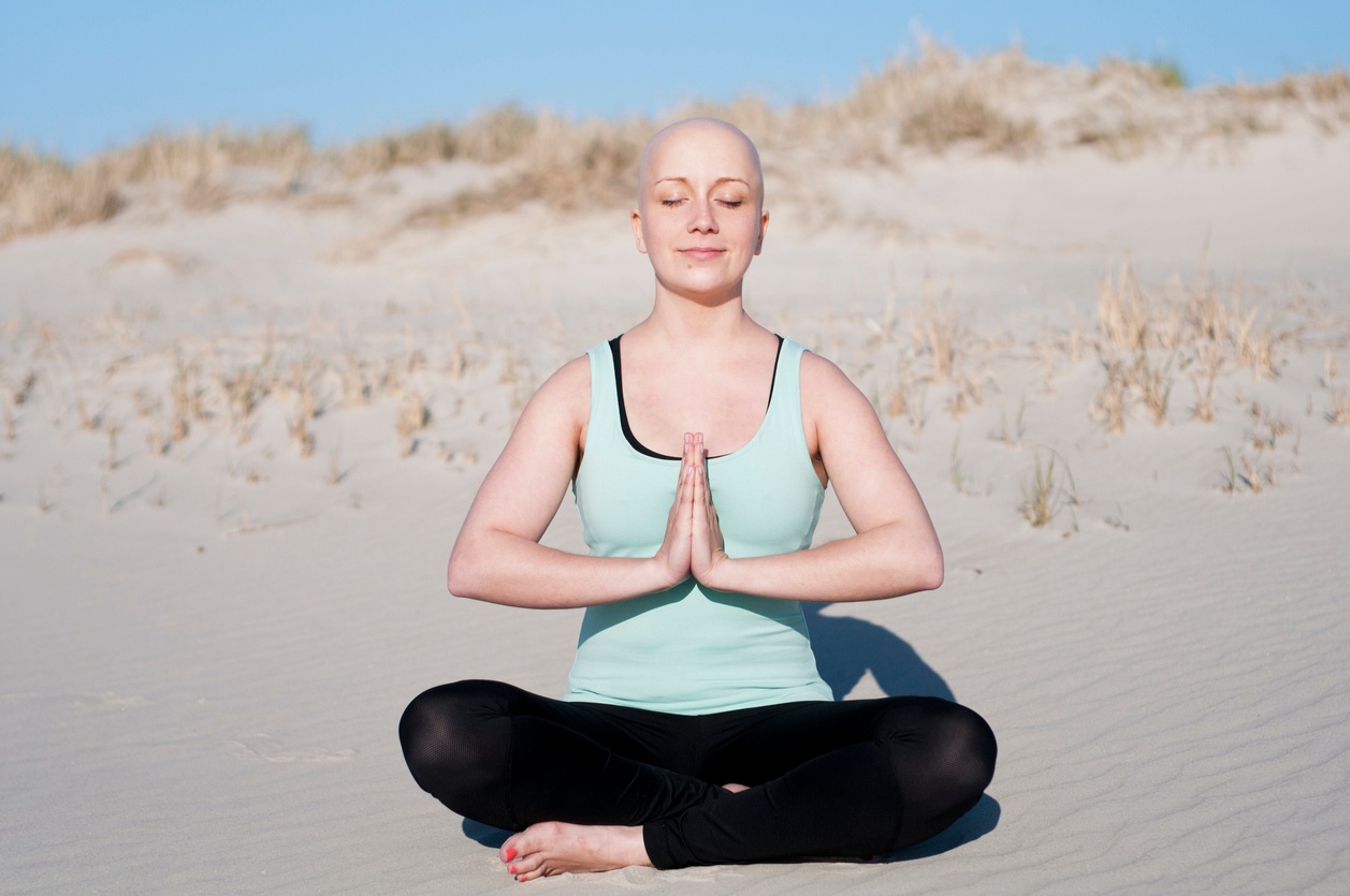 woman-cancer-survivor-meditate-yoga